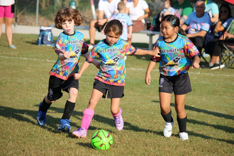 Kids playing soccer at Celebration Soccer Foundation